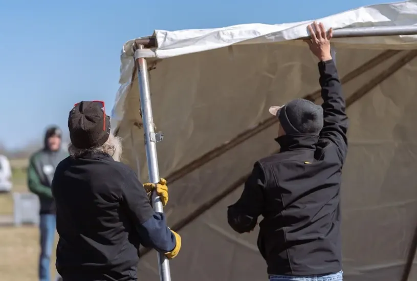 beyond_the_tent_crafting tent rental company installing tent
